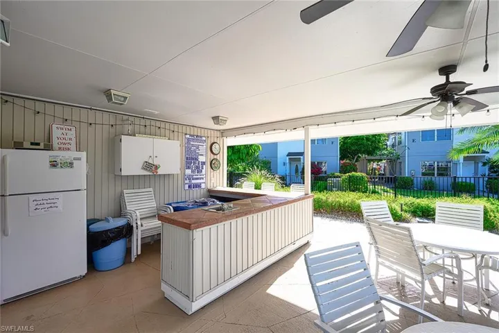 View of patio featuring outdoor dining area and ceiling fan