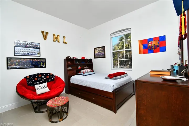 Tiled bedroom with baseboards
