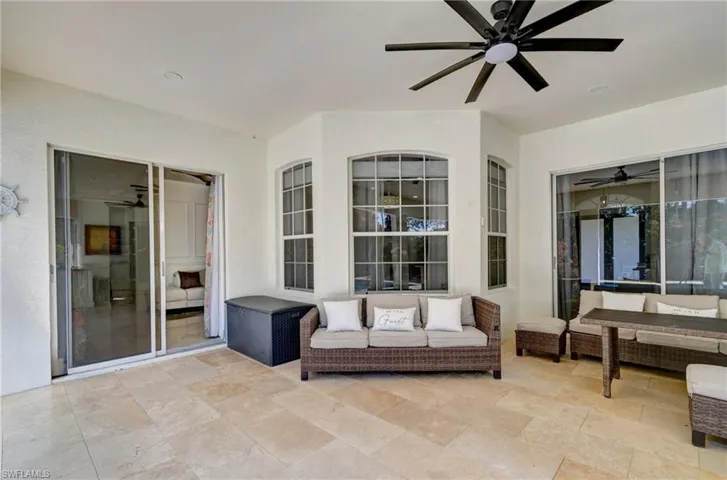 View of patio / terrace featuring a ceiling fan and an outdoor living space