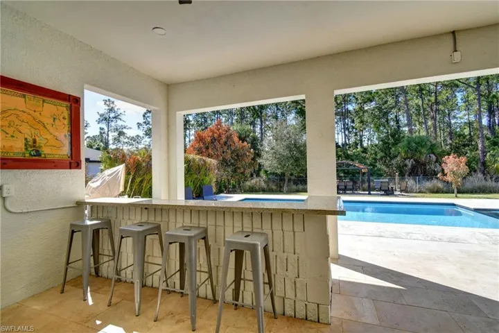 View of swimming pool featuring patio surround