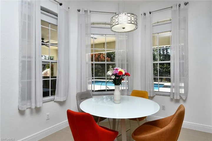 Dining area with ceiling fan and healthy amount of natural light