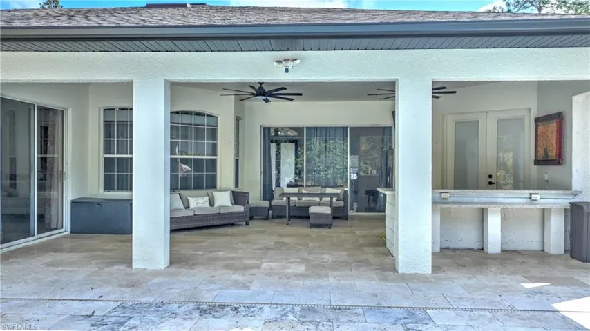 View of patio / terrace with ceiling fan and an outdoor living space