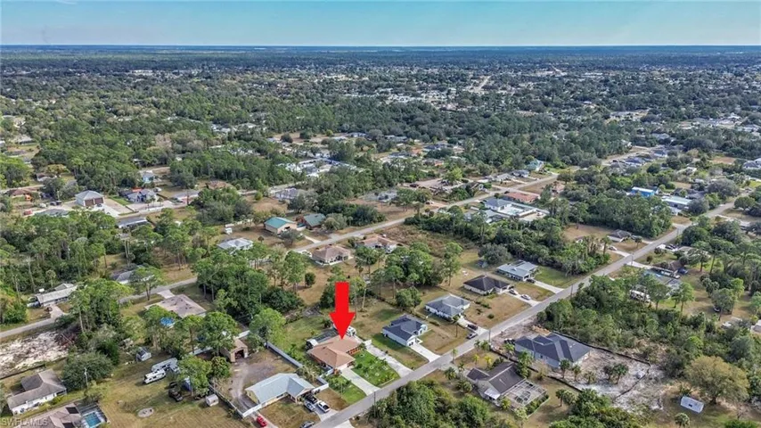 View of property location with nearby suburban area