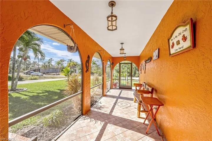Unfurnished sunroom with french doors