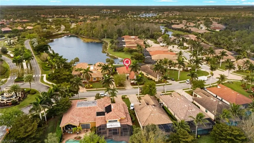 Drone / aerial view with a water view and a residential view