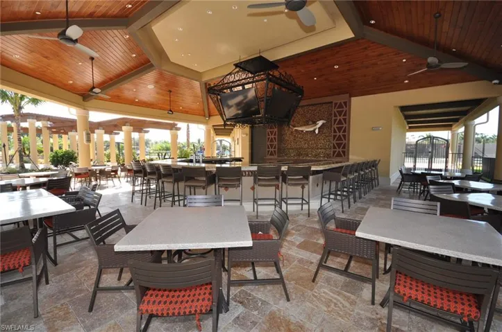 View of patio / terrace with outdoor wet bar and ceiling fan