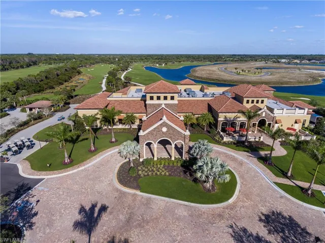 Bird's eye view with view of golf course and a water view