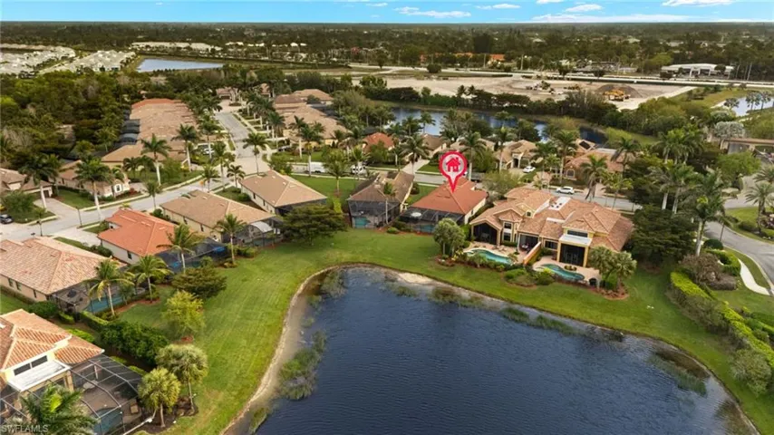 Drone / aerial view featuring a water view and a residential view
