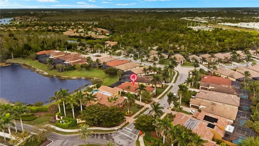 Drone / aerial view featuring a water view and a residential view