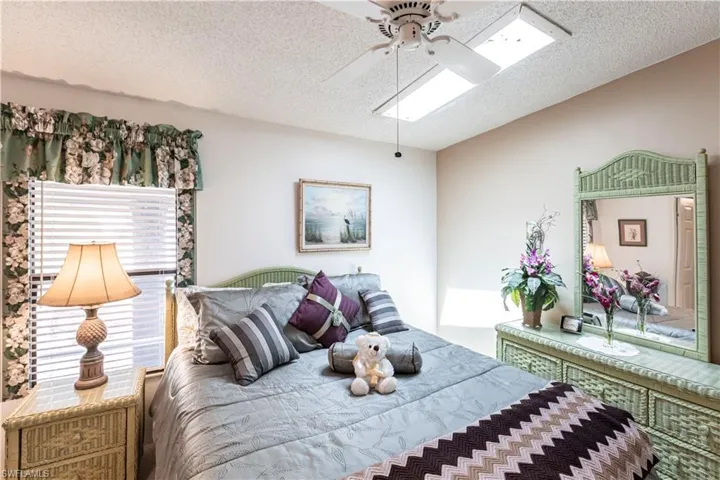 Bedroom featuring a textured ceiling and ceiling fan