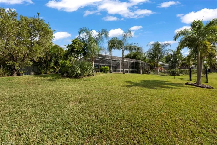 View of yard featuring a lanai