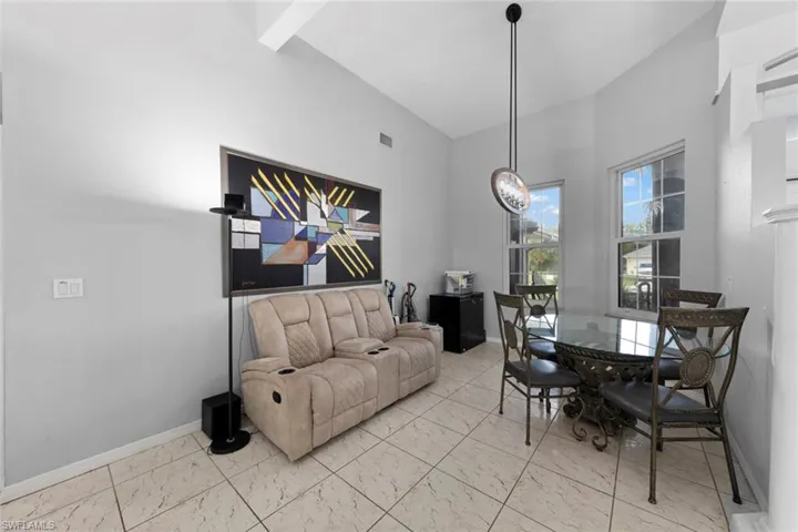 Dining space featuring lofted ceiling
