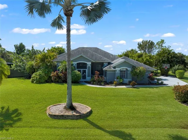 Ranch-style house featuring a front yard
