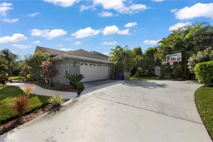 View of side of home featuring a garage