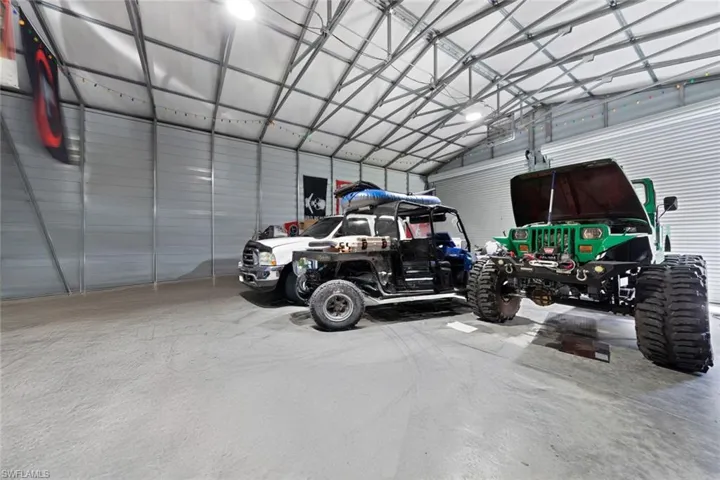 Garage with a garage door opener and a carport