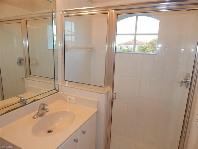 Master bathroom featuring a shower stall and vanity
