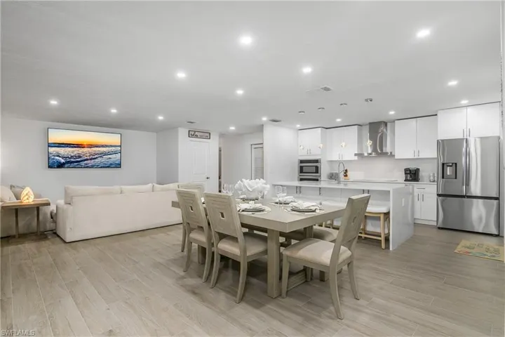 Dining room featuring light wood-style floors and recessed lighting