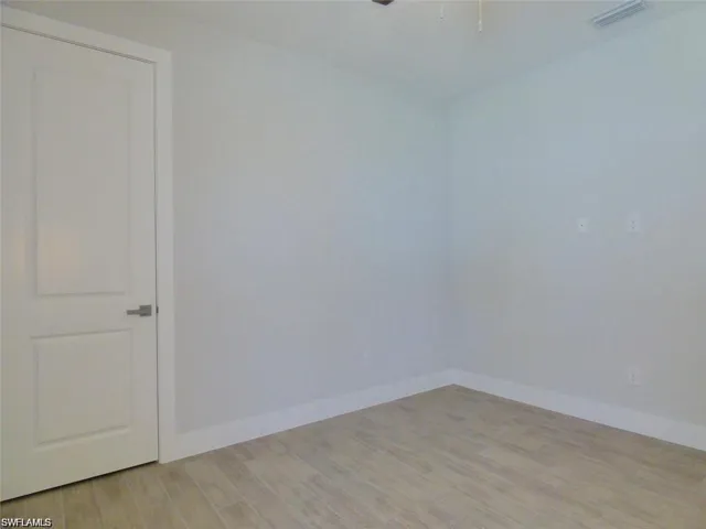 Unfurnished room featuring light hardwood / wood-style flooring