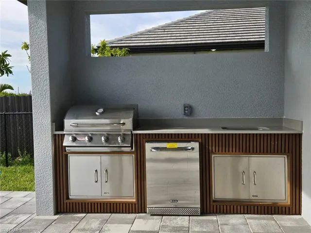View of patio featuring grilling area and an outdoor kitchen