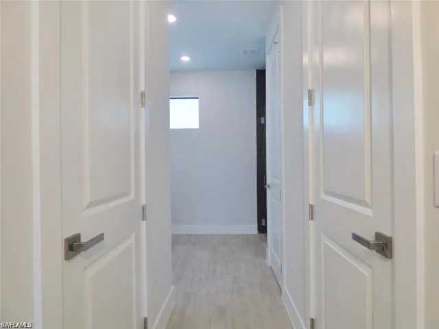 Hall featuring light wood-type flooring