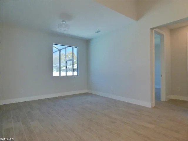 Spare room featuring light wood-type flooring