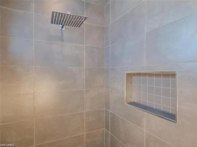 Details featuring tiled shower