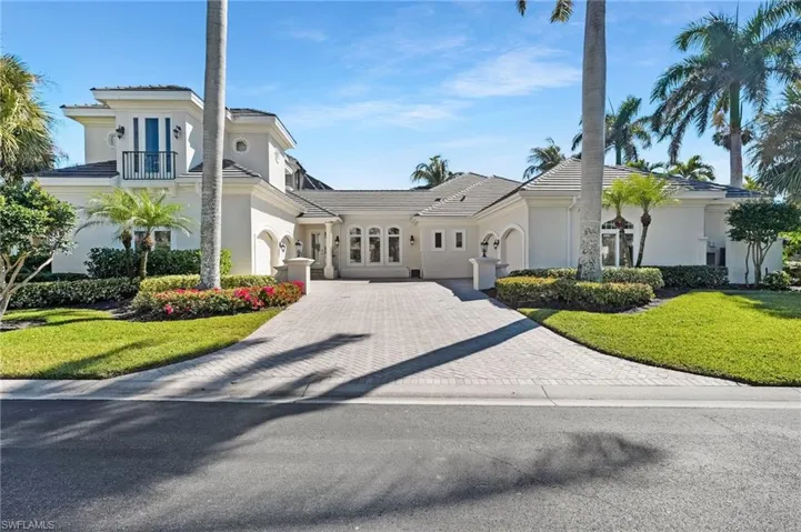 The side entrance welcomes you to a true four-car garage, framed by a beautifully designed pavered driveway, combining functionality with refined style.