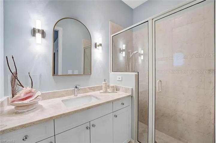 he second ensuite boasts a spacious walk-in shower for comfort and style.