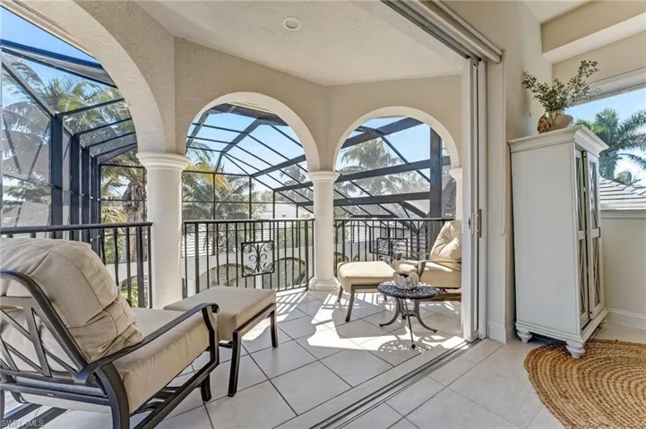 Across from the third-bedroom suite on the second level, a serene landing overlooks the courtyard through expansive zero-corner sliders—a perfect spot to relax, unwind, enjoy a book, or sip your favorite beverage.