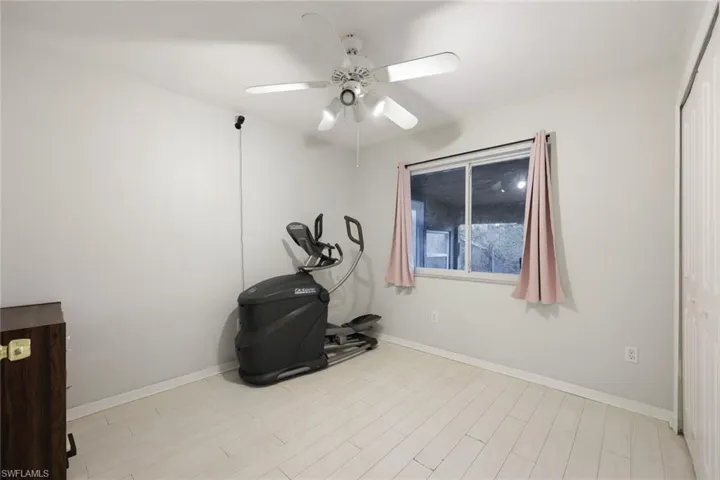 Bright interior space featuring light-toned walls and wood-finish flooring
