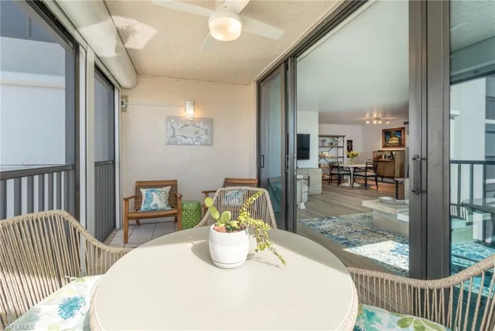 Balcony with ceiling fan and outdoor dining space