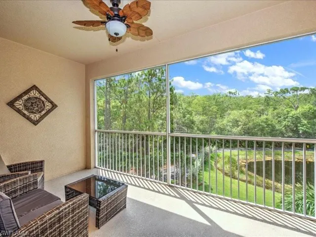 Balcony with ceiling fan and a water view