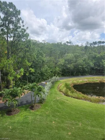 View of property's community featuring a yard