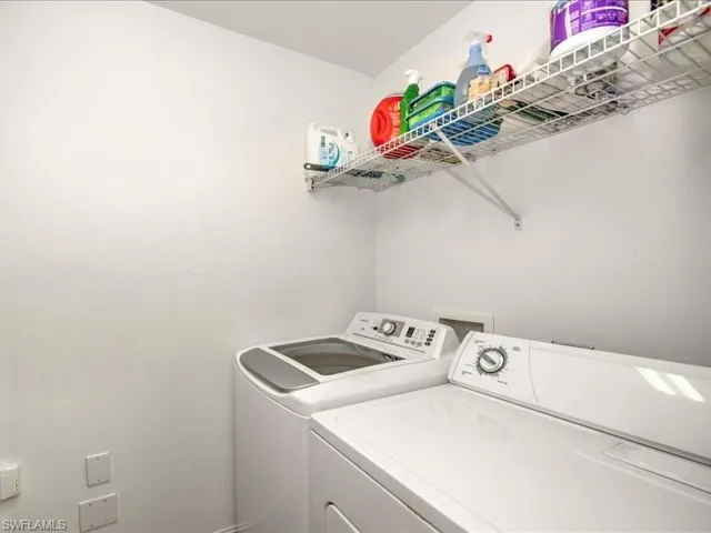 Washroom with washing machine and dryer