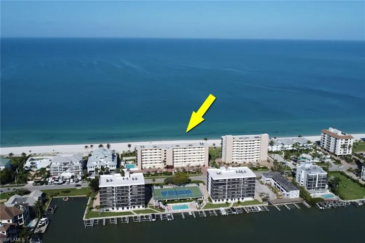 Beachfront condominium building with direct access to a white sand beach and the Gulf of Mexico
