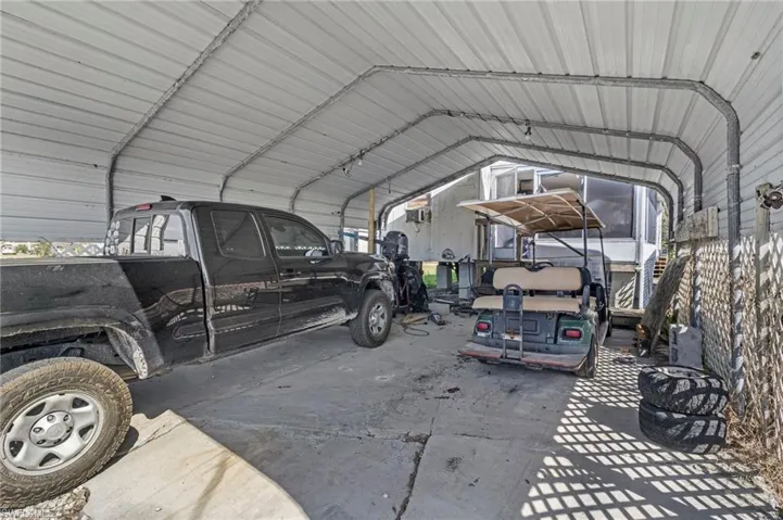 View of car parking featuring a detached carport