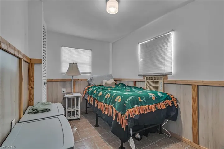 Bedroom with wooden walls