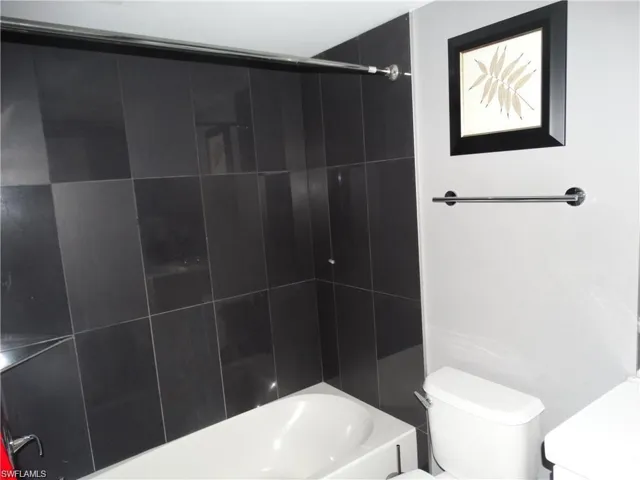 Bathroom featuring vanity and bathtub / shower combination