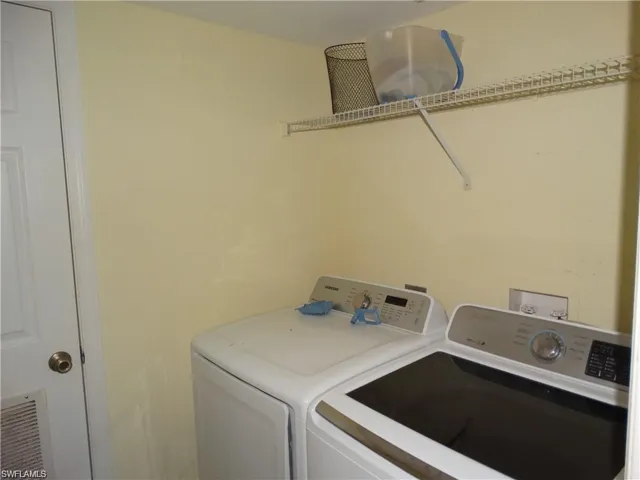 Laundry room featuring independent washer and dryer