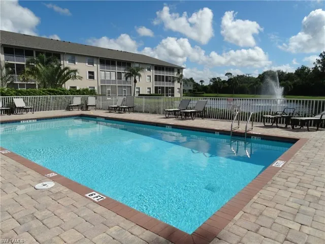 Community pool with a patio area