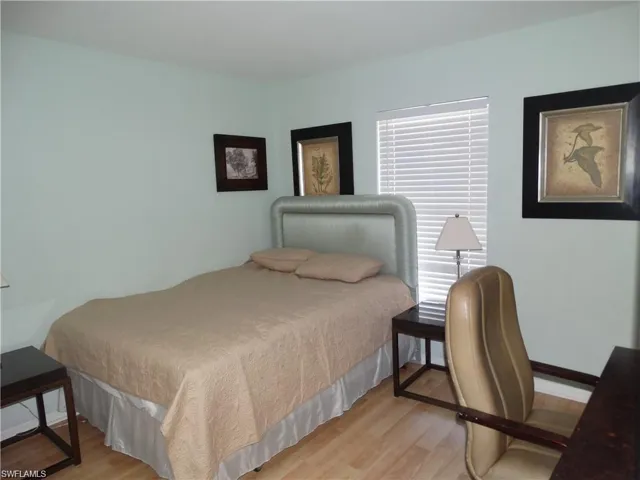 Bedroom with light wood-style floors