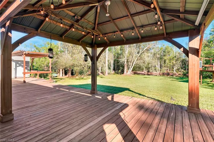 Huge entertainment deck with view of pond & back yard..