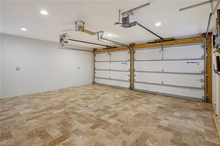 Garage can double as a great spill over space for visiting friends/relatives.  Beautiful stone floors, air conditioned, also has sink (not shown in picture).  Located right off the kitchen area.