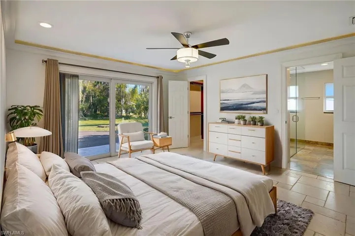 Virtual furniture placed in primary suite with view of custom walk-in closet, and primary bathroom