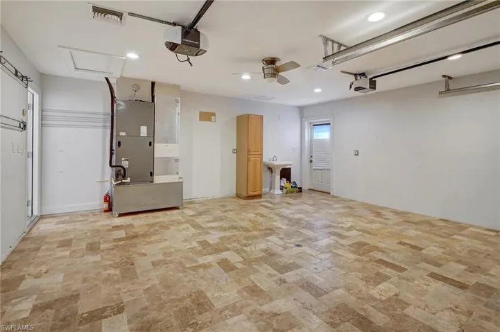 Interior view of garage showing sink and cabinet