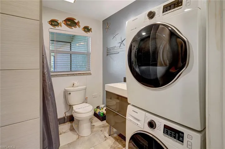 Mother-in-Law Suite:  Combo full bath with shower, vanity, and built in stackable washer & dryer