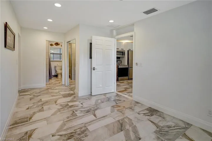 Mother-In-Law Suite:  View of entry door, bathroom and closet