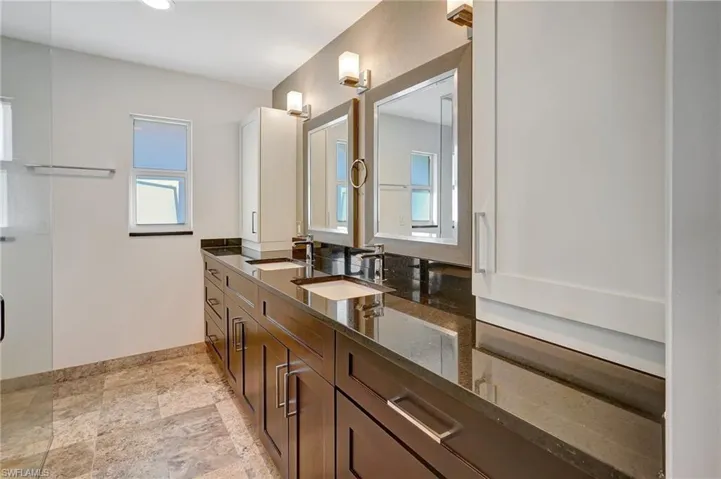 Top of the line custom cabinets, mirrors, with granite tops