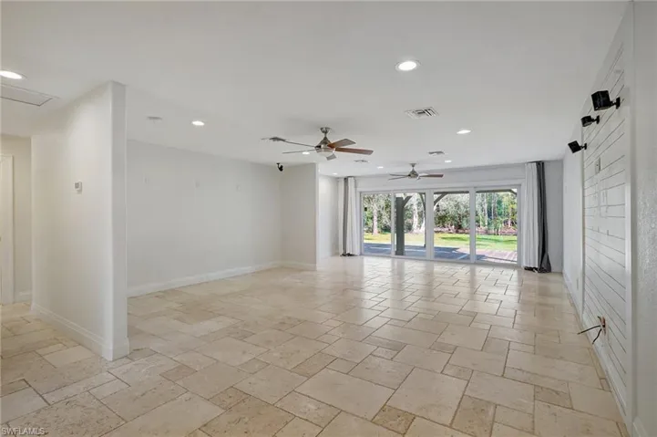 Living/dining/game room with view of lanai