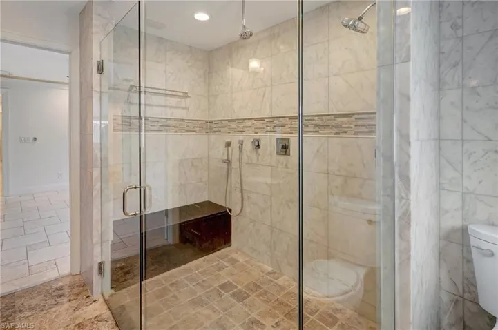 A truly oversized walk-in shower with large bench